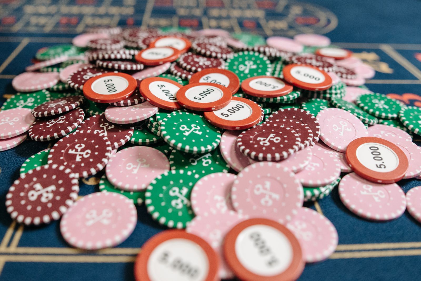 Poker chips on a casino table. Photo by Pavel Danilyuk, Pexels License